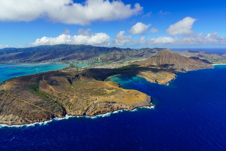 Stunning aerial view of Oahu's coastline showcasing vibrant blue waters and dramatic landscapes.